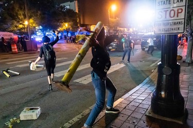 Protesters face off with police during rioting and protests in Atlanta on May 29, 2020.