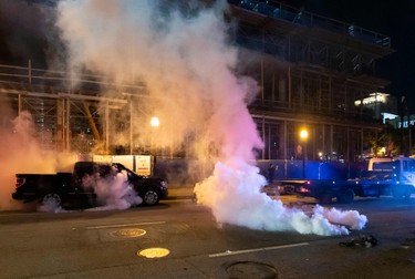 Tear gas explodes on a street during rioting and protests in Atlanta on May 29, 2020.