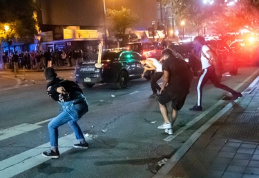 Protesters face off with police during rioting and protests in Atlanta on May 29, 2020.