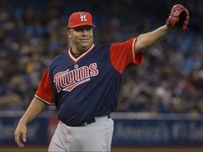 Minnesota Twins pitcher Bartolo Colon acknowledges the crowd as he is pulled from the game against the Toronto Blue Jays in Toronto on Friday, August 25, 2017.