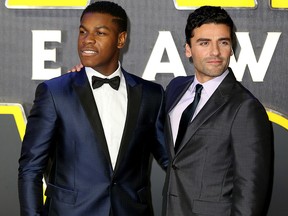 John Boyega and Oscar Isaac attend the European Premiere of "Star Wars: The Force Awakens" at Leicester Square on Dec. 16, 2015, in London, England.