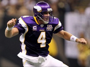 Brett Favre of the Minnesota Vikings celebrates after he threw a touchdown pass against the New Orleans Saints at Louisiana Superdome on September 9, 2010 in New Orleans.