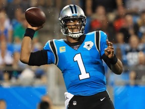 Quarterback Cam Newton of the Carolina Panthers looks to pass against the Tampa Bay Buccaneers game at Bank of America Stadium on September 12, 2019 in Charlotte, N.C.