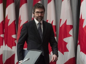 Minister of Canadian Heritage Steven Guilbeault makes his way to his seat for a news conference in Ottawa, Friday, April 17, 2020.