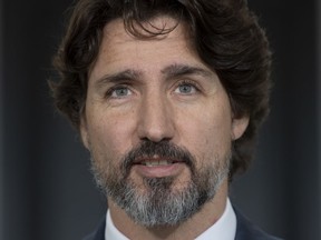 Prime Minister Justin Trudeau delivers his opening remarks at the start of a news conference outside Rideau Cottage in Ottawa, Monday May 25, 2020.