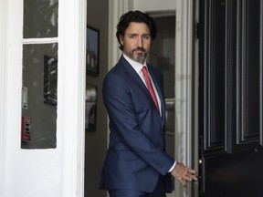 Prime Minister Justin Trudeau arrives for his daily news conference on the COVID-19 pandemic outside his residence at Rideau Cottage in Ottawa, on Tuesday, May 19, 2020.