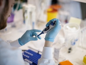A researcher works on a vaccine against the new coronavirus COVID-19 at the Copenhagen's University research lab in Copenhagen, Denmark, on March 23, 2020.