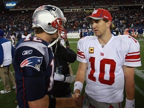 In this Nov. 6, 2011, file photo, Tom Brady  of the New England Patriots congratulates  Eli Manning #10 of the New York Giants after the New York Giants 24-20 win on in Foxboro, Mass.