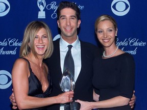 Actors Jennifer Aniston (left) David Schwimmer and Lisa Kudrow hold their award as Favorite Television Comedy Series at the 27th annual People's Choice Awards in Pasadena January 7, 2001.