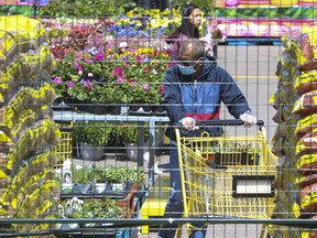 Customers shop at a No Frills outdoor garden centre in North York on May 3, 2020. More businesses could soon open throughout Ontario as part of the early stages of the economic recovery related to the COVID-19 pandemic.