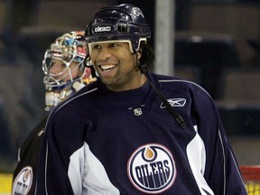 Edmonton Oilers forward Georges Laraque has a laugh during practice at Rexall Place in Edmonton.