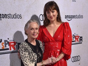 Actress Dakota Johnson, right, and her grandmother actress Tippi Hedren arrive for the Amazon Studios Los Angeles premiere of "Suspiria" at the Arclight Hollywood Cinerama Dome in Hollywood, California on Oct. 24, 2018.