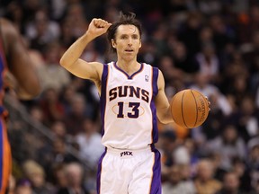 Steve Nash #13 of the Phoenix Suns handles the ball during the NBA game against the New York Knicks at US Airways Center on January 7, 2011 in Phoenix, Arizona.