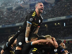 Kyle Walker of Manchester City joins in as Kevin De Bruyne of Manchester City celebrates with teammates. Walker allegedly broke curfew for sex romps with two hookers.