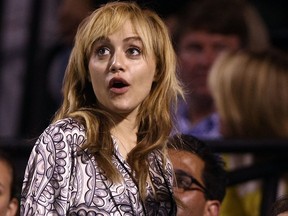 Actress Britney Murphy watches as Roger Federer of Switzerland plays a match against Andy Roddick during day eleven of the Sony Ericsson Open at the Crandon Park Tennis Center on April 3, 2008 in Key Biscayne, Florida.