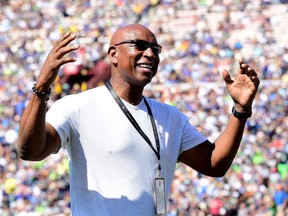 Former Los Angeles Rams Eric Dickerson laugh on the sidelines during a stop in play in a game between the Seattle Seahawks and the Los Angeles Rams at Los Angeles Memorial Coliseum on October 8, 2017 in Los Angeles, Calif.