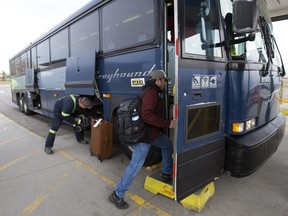 Customers board the last outgoing Greyhound bus at the Edmonton Greyhound station, Wednesday Oct. 31, 2018.