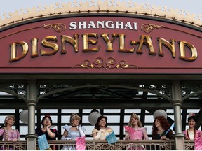 Actors dressed as Disney characters are seen at Shanghai Disney Resort as the Shanghai Disneyland theme park reopens following a shutdown due to the coronavirus disease (COVID-19) outbreak, in Shanghai, China May 11, 2020.