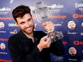 Duncan Laurence of the Netherlands, the winner of the 2019 Eurovision Song Contest, holds up the trophy during a news conference in Tel Aviv, Israel May 19, 2019.