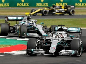 Formula One F1 - British Grand Prix - Silverstone Circuit, Silverstone, Britain - July 14, 2019   Mercedes' Lewis Hamilton and Mercedes' Valtteri Bottas in action during the race.