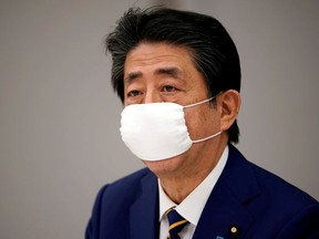 Japanese Prime Minister Shinzo Abe declares state of emergency during a meeting of the new coronavirus task force at the prime minister's official residence in Tokyo, Japan, April 7, 2020.