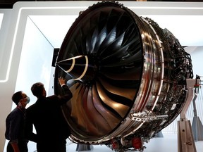 A man looks at Rolls Royce's Trent Engine displayed at the Singapore Airshow in Singapore February 11, 2020.