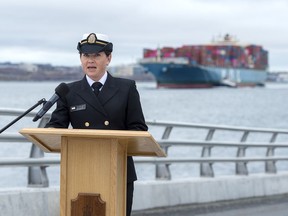 Lt. Melissa Kia, speaking on the behalf of the next of kin of Sub-Lt. Matthew Pyke, reads a statement at the navy dockyard in Halifax on Tuesday, May 5, 2020.