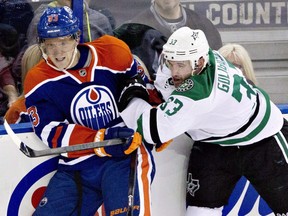 Dallas Stars Alex Goligoski (33) checks Edmonton Oilers Ales Hemsky (83) during second period NHL hockey action in Edmonton, on Wednesday Nov. 13, 2013.