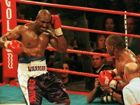 Evander Holyfield reacts to having his ear bitten by Mike Tyson at the MGM Grand in Las Vegas in 1997.