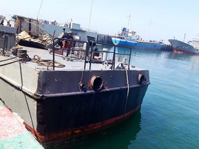 A handout picture provided by Iranian army official website on May 11, 2020 shows the damaged Konarak vessel, hit by a friendly fire missile during naval exercises, docked at the Jask port, in southern Hormozgan province.