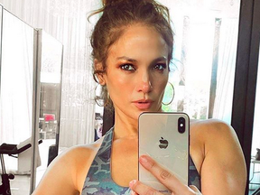 Jennifer Lopez's gym selfie went viral after fans spotted a masked man in the background.