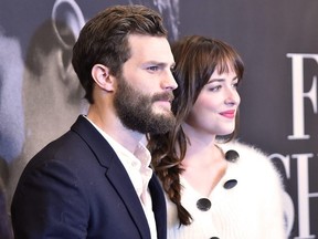 Actors Jamie Dornan and Dakota Johnson attend the "Fifty Shades Of Grey" New York Fan First screening at Ziegfeld Theatre on February 6, 2015 in New York.