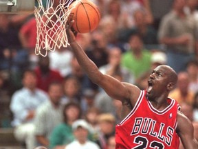 Chicago Bulls’ Michael Jordan drives to the hoop during as Charlotte Hornets’ J.R. Reid looks on from under the basket in during a playoff game on May 10, 1998. Jordan and the Bulls’ 1997-98 championship run is the subject of The Last Dance, a new documentary on Netflix.  File photo