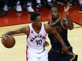 DeMar DeRozan of the Toronto Raptors gets blocked by J.R. Smith of the Cleveland Cavaliers during the Eastern Conference final at the Air Canada Centre in Toronto on Friday May 27, 2016.