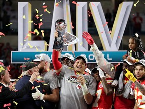 Kansas City Chiefs' Patrick Mahomes celebrates with the Vince Lombardi trophy after winning the Super Bowl LIV at Hard Rock Stadium, in Miami, Fla., on Feb. 2020.