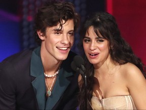 Shawn Mendes and Camila Cabello accept the Collaboration of the Year award during the 2019 American Music Awards in Los Angeles.