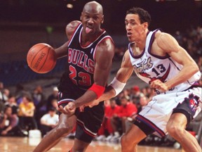 Bulls’ Michael Jordan drives on the Raptors’ Doug Christie.