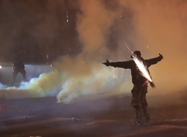 A tear gas canister almost hits a protester during protests sparked by the death of George Floyd while in police custody on May 29, 2020 in Minneapolis, Minn.