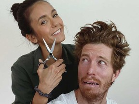 Nina Dobrev shared this photo on Instagram of herself giving Shaun White a haircut during the lockdown.
