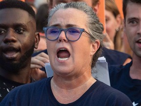 Rosie O'Donnell sings during a protest against U.S. President Donald Trump in front of the White House in Washington, D.C., on Aug. 6, 2018.