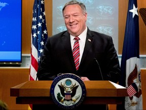 U.S. Secretary of State Mike Pompeo smiles during a news conference at the State Department, in Washington, April 29, 2020.