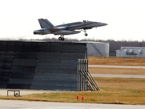 A CF-18 Hornet fighter jet takes off from 4 Wing Cold Lake on Tuesday, Oct. 21, 2014.