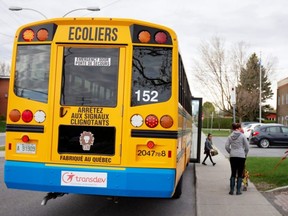 A school bus arrives carrying one student as schools outside the greater Montreal region begin to reopen amid the COVID-19 outbreak, in Saint-Jean-sur-Richelieu, Quebec, Monday, May 11, 2020.