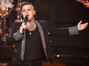 British singer Robbie Williams performs during the "Ein Herz fuer Kinder" (A Heart for Children) charity gala in Berlin on Dec. 7, 2019.