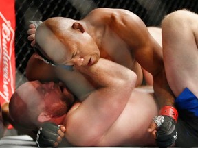 Ronaldo Souza (top) of Brazil fights against Tim Boetsch (bottom) of the U.S. in the first round of their middleweight bout during UFC 208 at the Barclays Center in Brooklyn, N.Y., on Feb. 11, 2017.