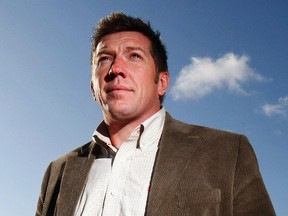 Former NHL player Sheldon Kennedy stands on a hillside overlooking Calgary on October 9.