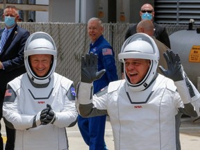 NASA astronauts Douglas Hurley and Robert Behnken head to launch Pad39A to board a SpaceX Falcon 9 rocket during NASA's SpaceX Demo-2 mission to the International Space  Station from NASA's Kennedy Space Center in Cape Canaveral, Fla., Wednesday, May 27, 2020.