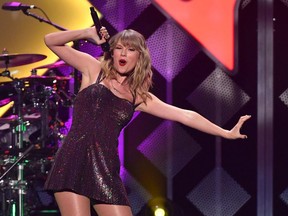 In this file photo taken on December 13, 2019 Taylor Swift performs onstage during the Z100's iHeartRadio Jingle Ball 2019 at Madison Square Garden in New York.