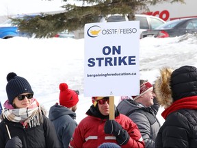 Teachers and support staff represented by the Ontario Secondary School Teachers' Federation take part in a one-day strike in Sudbury, Ont., on Friday, Feb. 28, 2020.