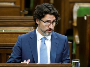 Prime Minister Justin Trudeau waits for a meeting of the special committee on the COVID-19 pandemic to begin on Parliament Hill in Ottawa on Wednesday, May 13, 2020.